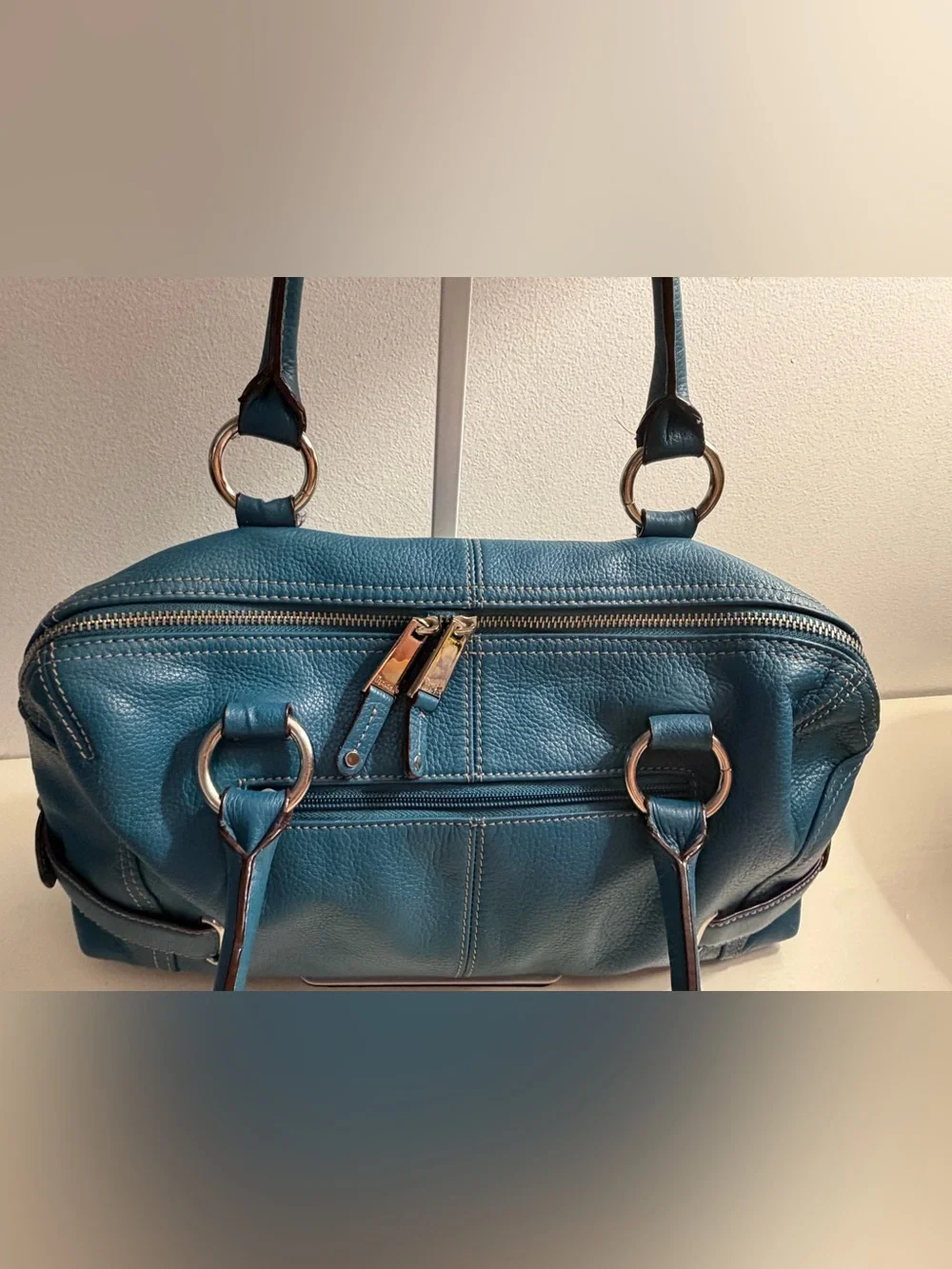 Tignanello teal blue pebbled leather satchel with silver toned hardware.